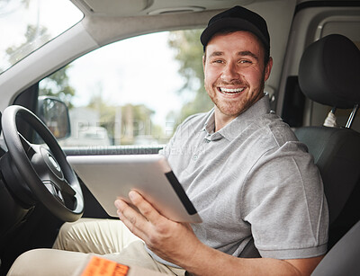 Buy stock photo Cropped portrait of a handsome young delivery man using a tablet while sitting in his van