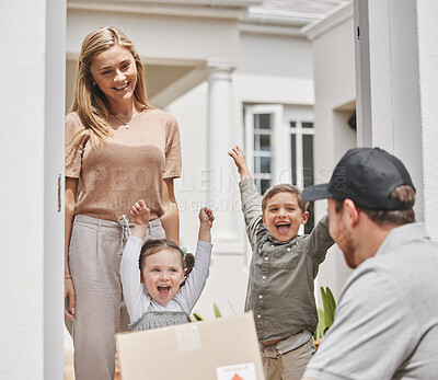 Buy stock photo Cropped shot of two adorable little kids cheering while a male courier delivers a package to their mom