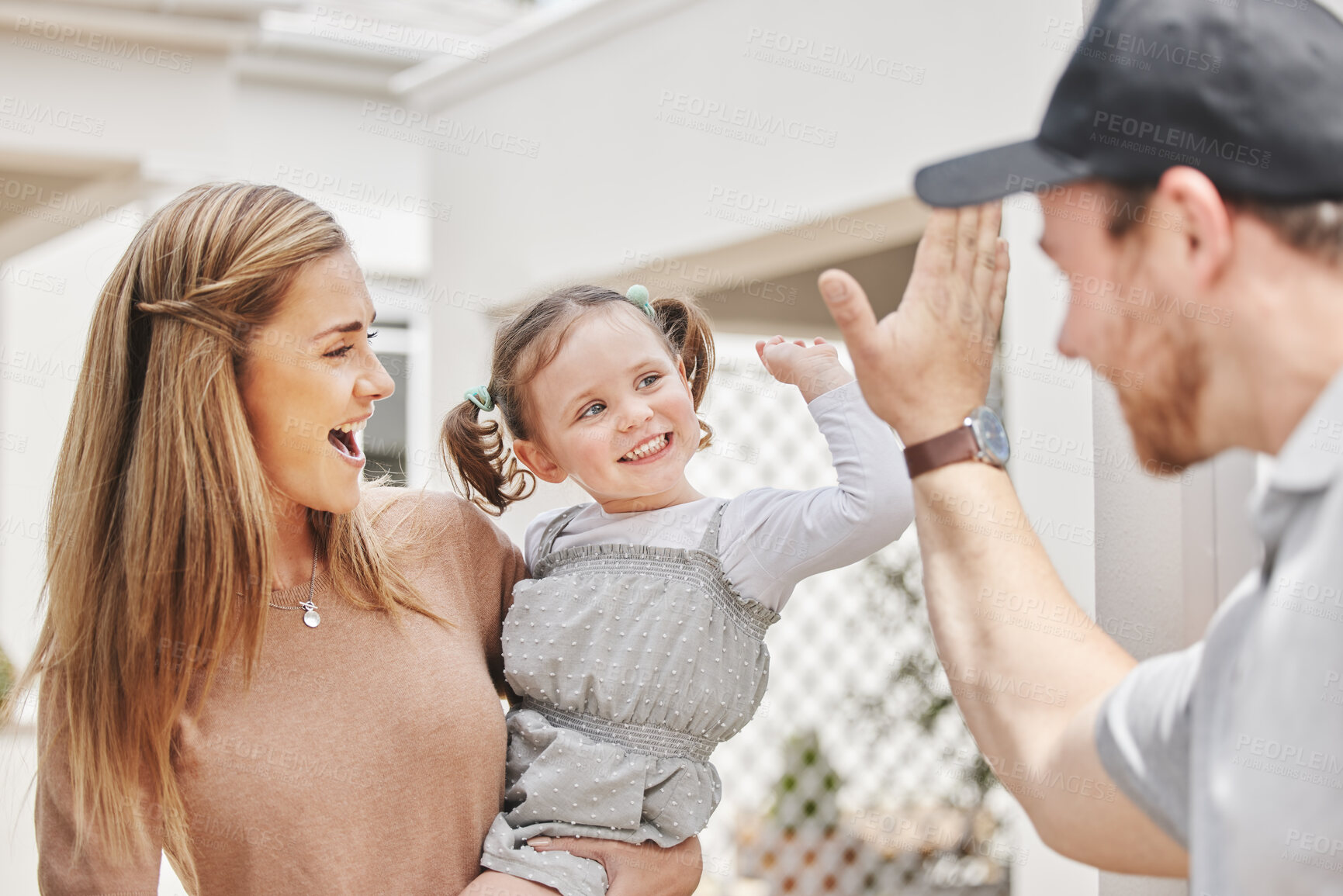 Buy stock photo Cropped shot of an adorable little girl high fiving a male courier who is delivering a package to her mom