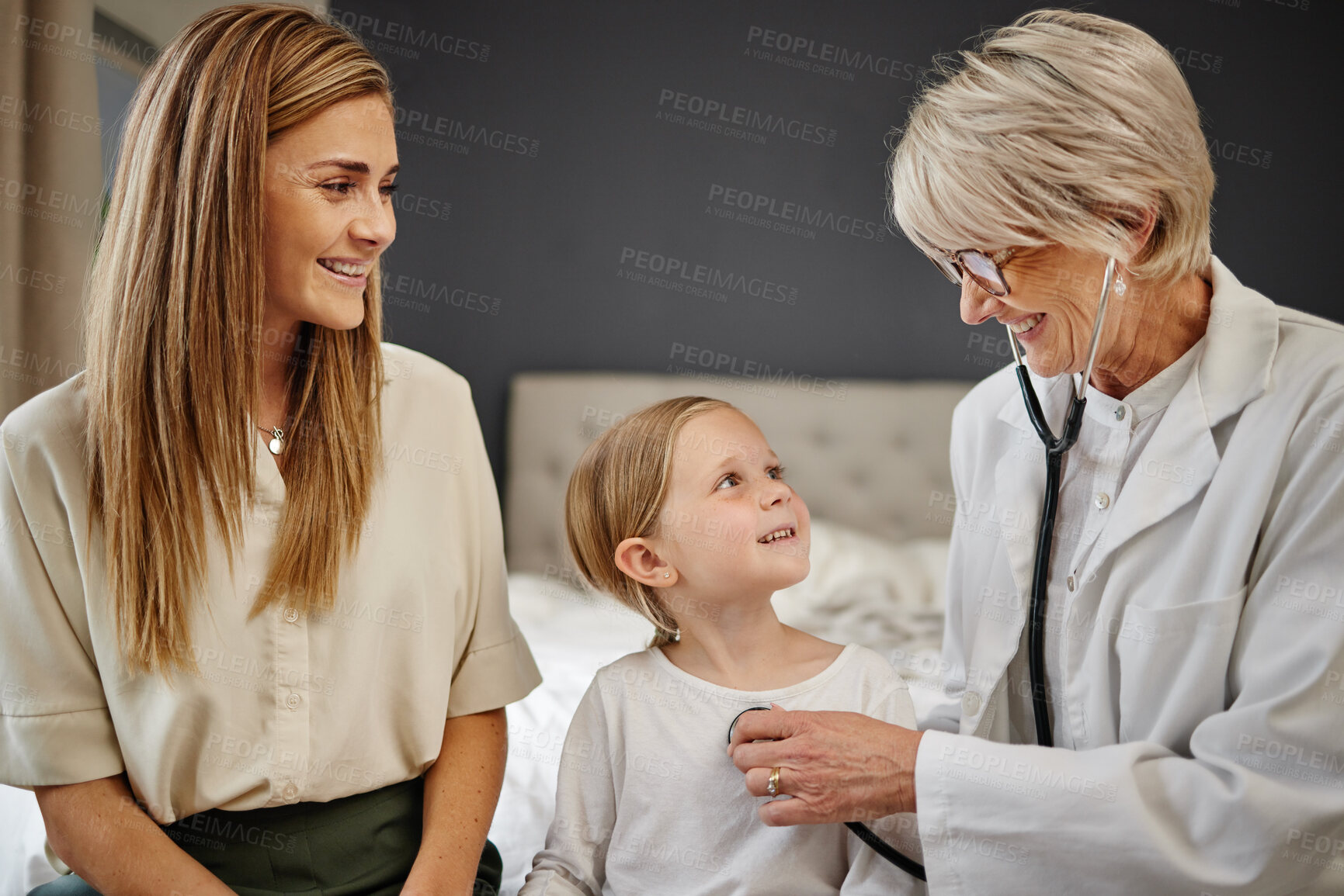 Buy stock photo Happy mother, child and bed with doctor checking heart beat for checkup, visit or diagnosis at home. Mom, daughter and medical worker listening to breathing with stethoscope for exam or test at house