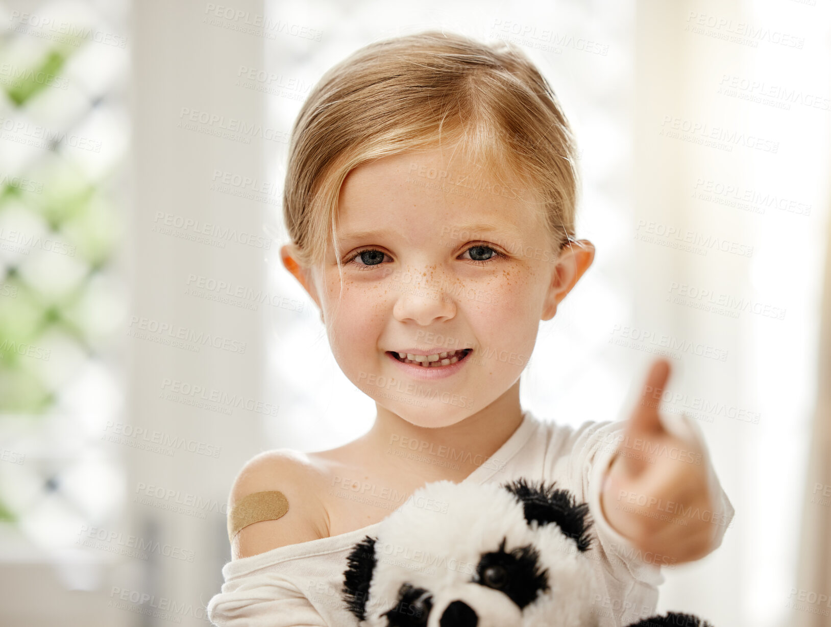 Buy stock photo Girl, child and thumbs up with bandage for vaccine with smile, agreement and like sign at hospital. Kid, patient and plaster for injection with icon, emoji and symbol for yes with feedback in clinic