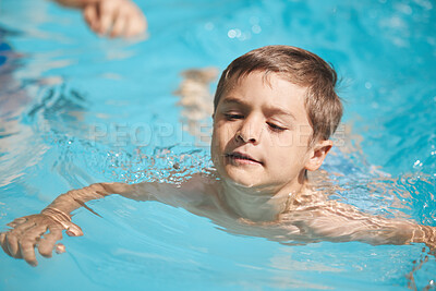 Buy stock photo Fun, swimming and boy child in pool for summer holiday, relax or playing at hotel for outdoor island tourism. Happy, travel and kid in water on tropical vacation, weekend resort and playful adventure