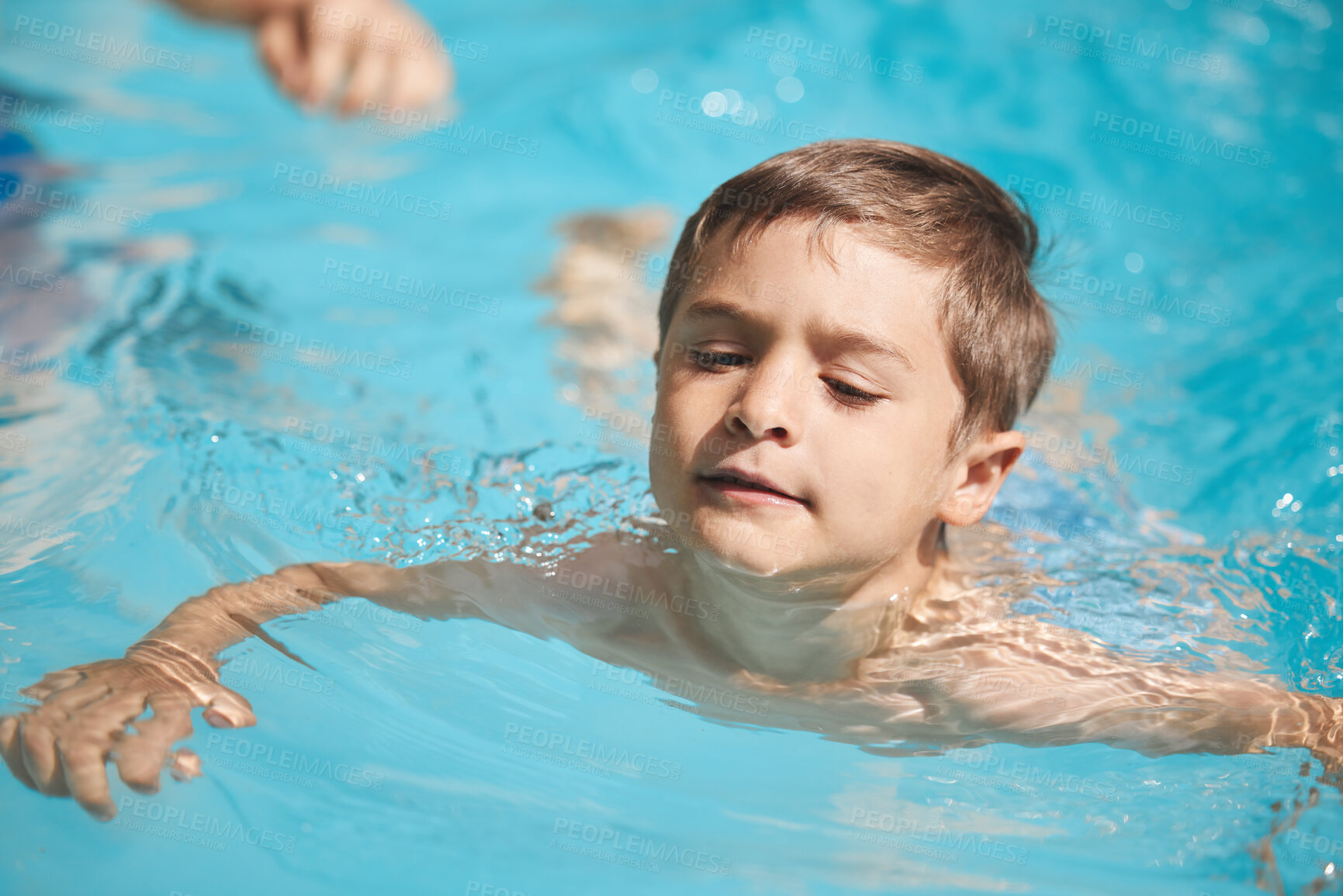 Buy stock photo Fun, swimming and boy child in pool for summer holiday, relax or playing at hotel for outdoor island tourism. Happy, travel and kid in water on tropical vacation, weekend resort and playful adventure