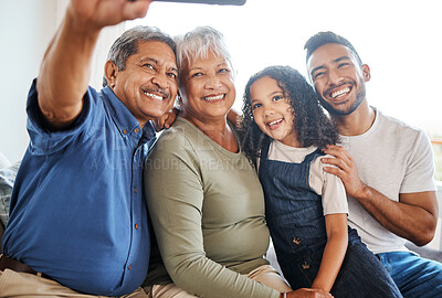 Buy stock photo Happy family, smile and selfie in living room for social media, vlog or online post at home. Grandparents, father and child smiling for photo, memory or profile picture together on holiday weekend