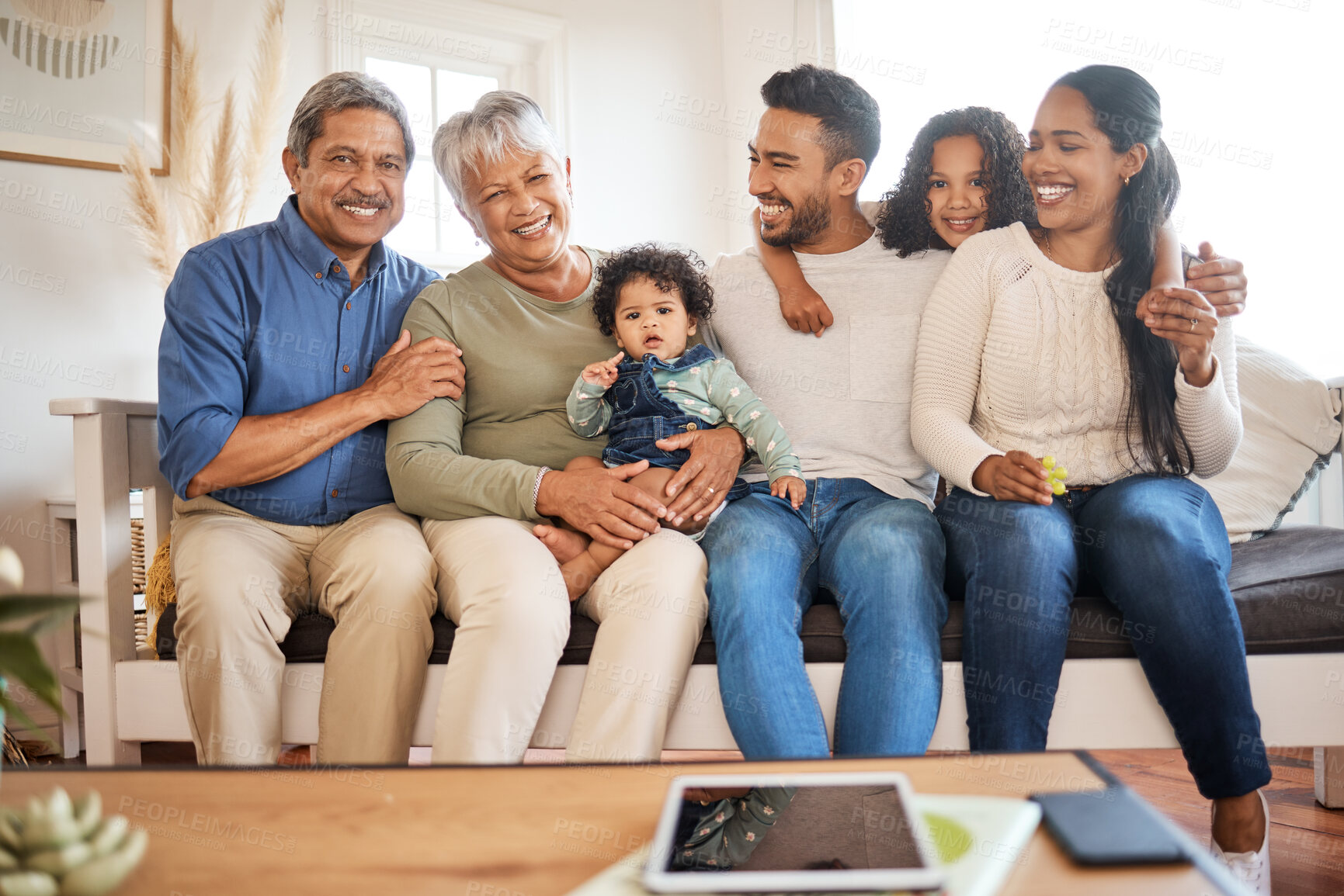 Buy stock photo Shot of a family spending time together at home