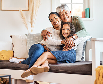 Buy stock photo Shot of a grandmother spending time with her daughter and grandchild at home