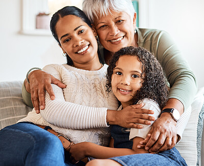 Buy stock photo Shot of a grandmother spending time with her daughter and grandchild at home