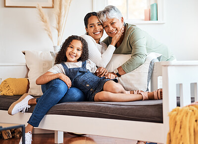 Buy stock photo Shot of a grandmother spending time with her daughter and grandchild at home
