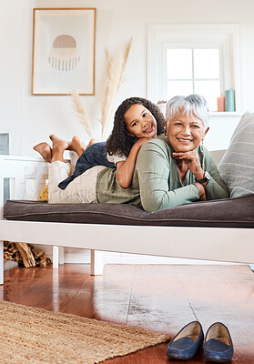Buy stock photo Shot of a grandmother spending time with her grandchild at home