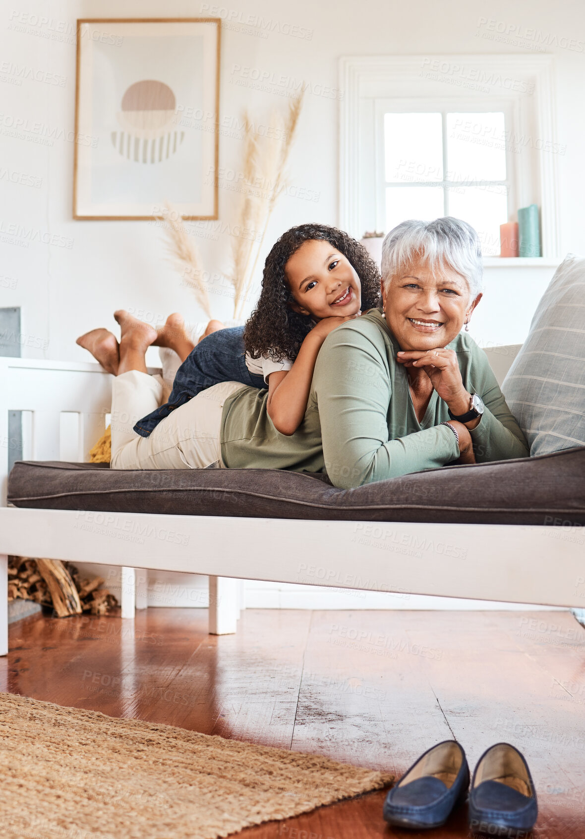 Buy stock photo Shot of a grandmother spending time with her grandchild at home
