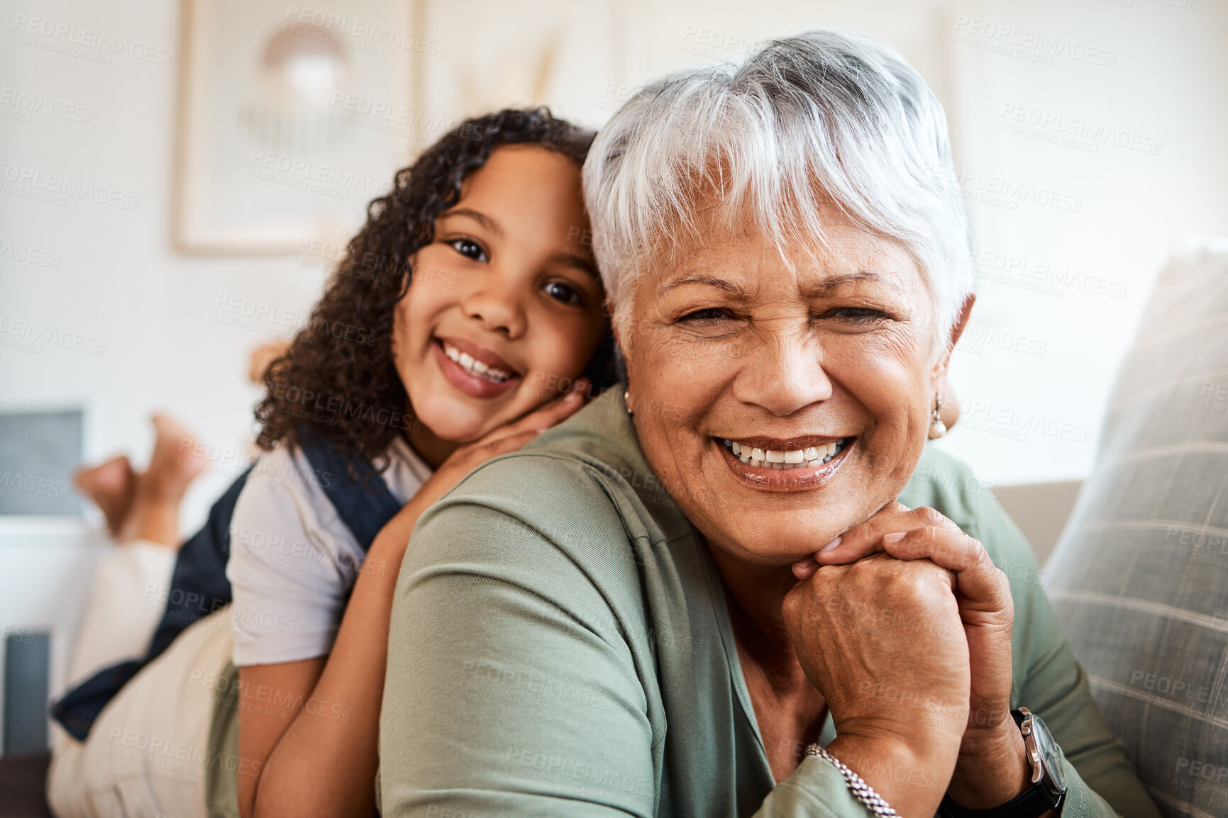 Buy stock photo Shot of a grandmother spending time with her grandchild at home