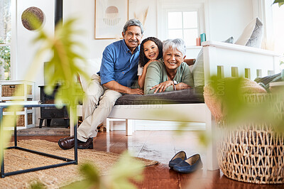 Buy stock photo Shot of a grandchild spending time with her grandparents at home