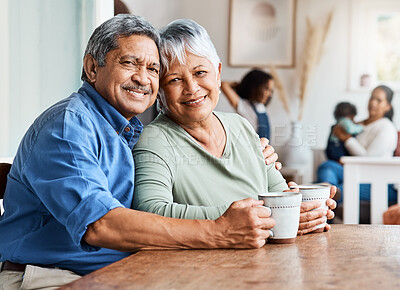 Buy stock photo Shot of a mature couple drinking coffee together at home