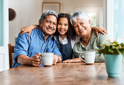 Buy stock photo Shot of a grandchild spending time with her grandparents at home