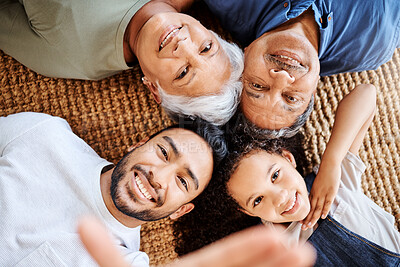 Buy stock photo Shot of a family taking selfies together at home