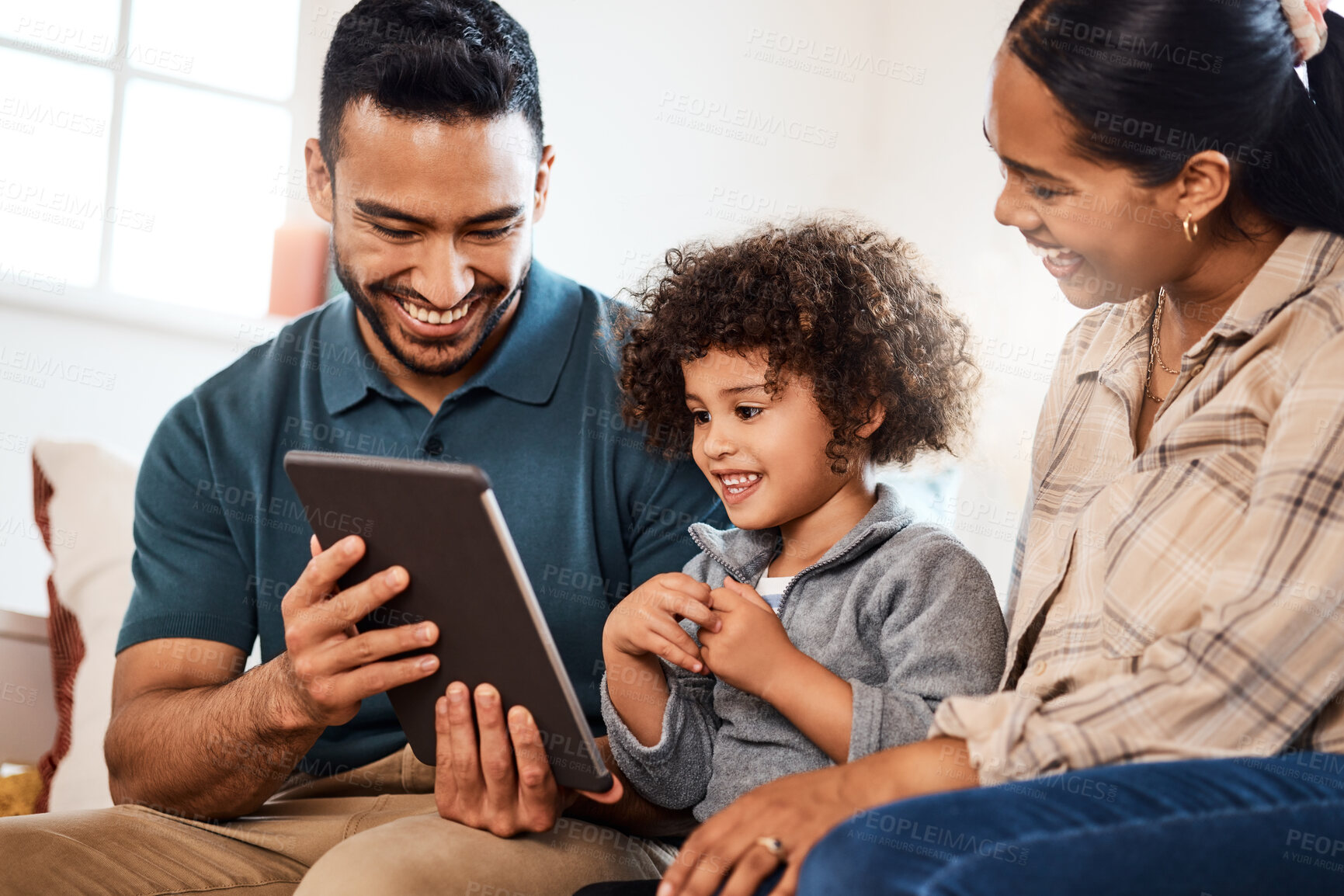 Buy stock photo Parents, boy and tablet on sofa in home, bonding and smile for web streaming, love and relax in lounge. People, dad and mom with child on couch, tech or film subscription on app at family house