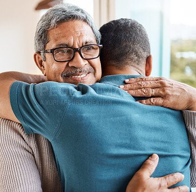 Buy stock photo Shot of a father and son hugging at home