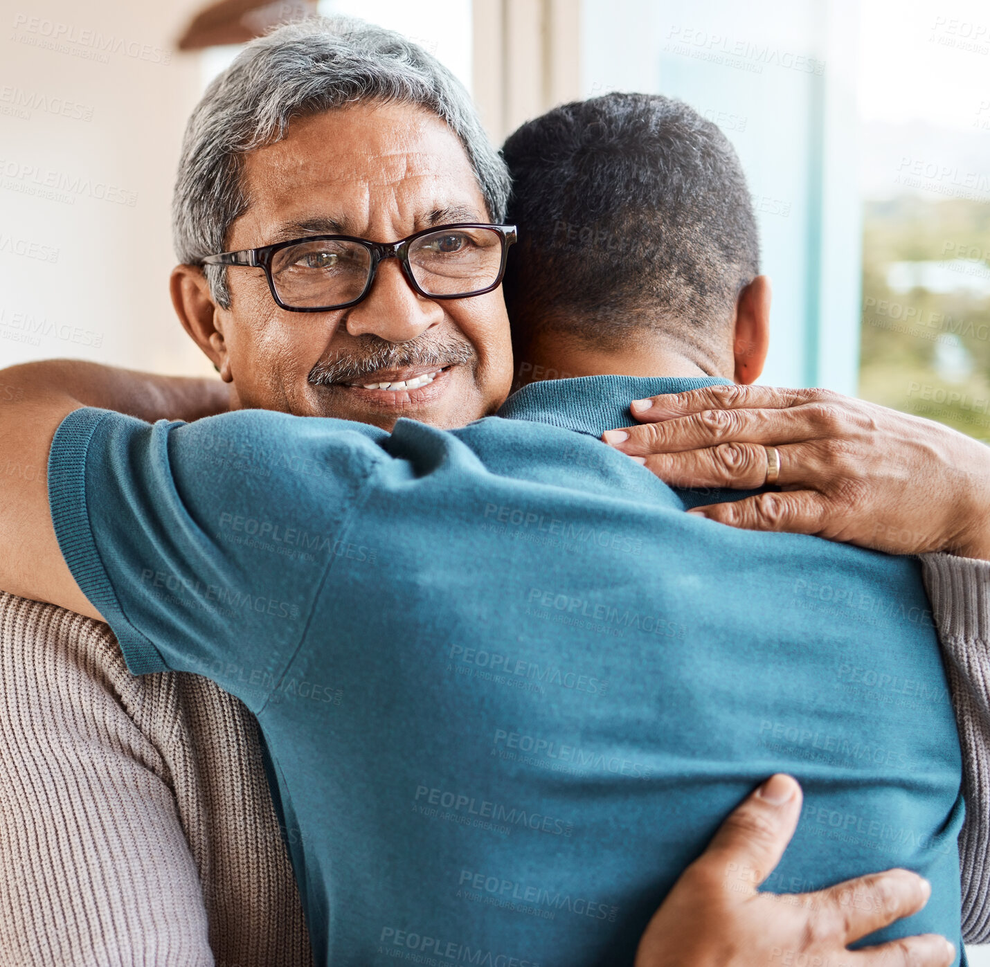 Buy stock photo Happy, hug and man with senior father in home with bonding, love or connection together on weekend. Smile, family time and male person embracing elderly dad with comfort in living room at house.