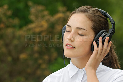 Buy stock photo Relax, zen or woman with headphones for music, radio or streaming for thinking outdoor in environment. Eyes closed, student or technology for audio, sound or listening in nature, garden or backyard