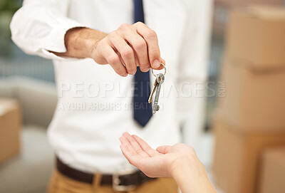 Buy stock photo Shot of an unrecognizable agent handing over keys to a new homeowner