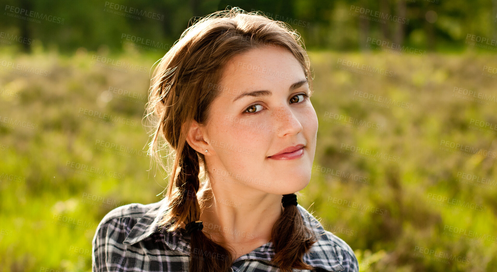 Buy stock photo Woman, portrait and relax in grass field for spring with happiness, flowers and wellness. Female gen z person, rest and fresh air with smile by countryside for weather, farm environment and sunshine