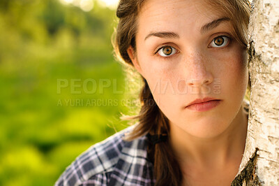 Buy stock photo Face, woman and student with leaning on tree for university break, relax and chill in summer holiday in California. Female person, portrait and park for nature, vacation and day off on college