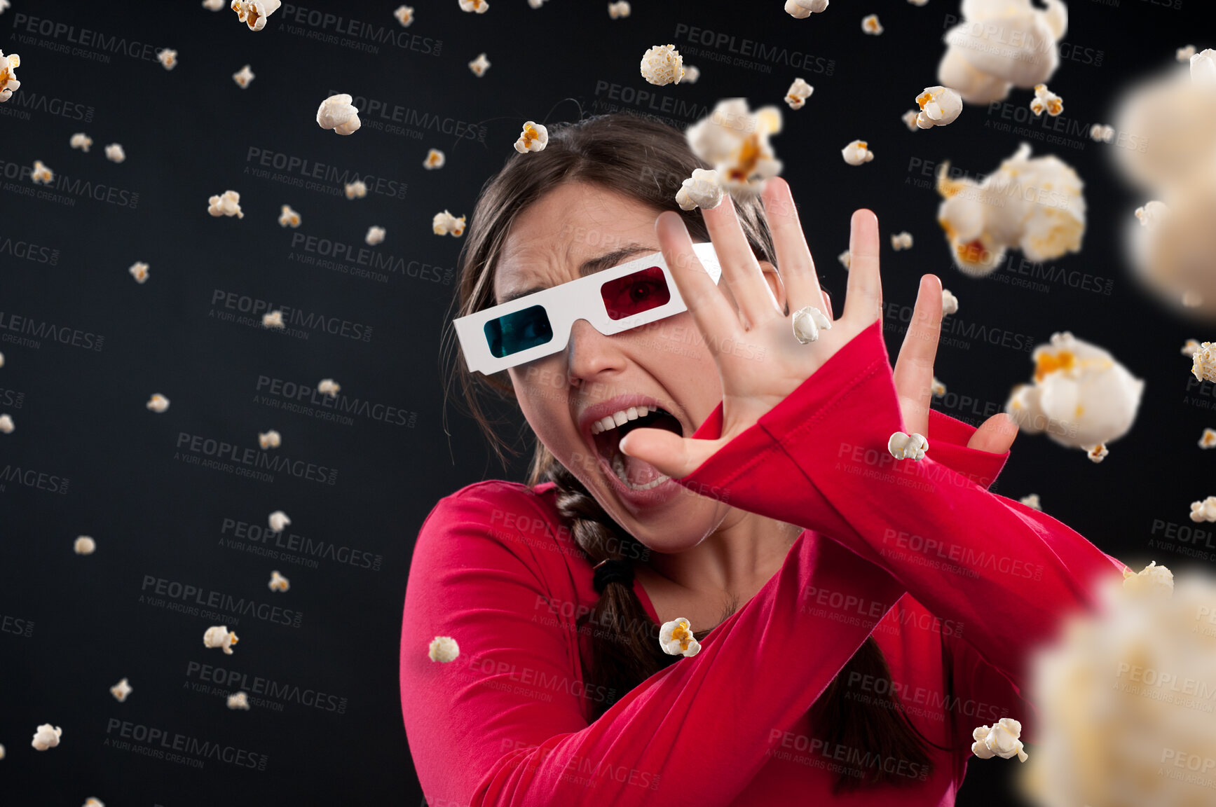 Buy stock photo Girl, popcorn and 3d glasses with scream while watching movie, film or horror by dark background. Fantasy, face and shout of female person with mockup in studio for mystery, surreal or color lenses