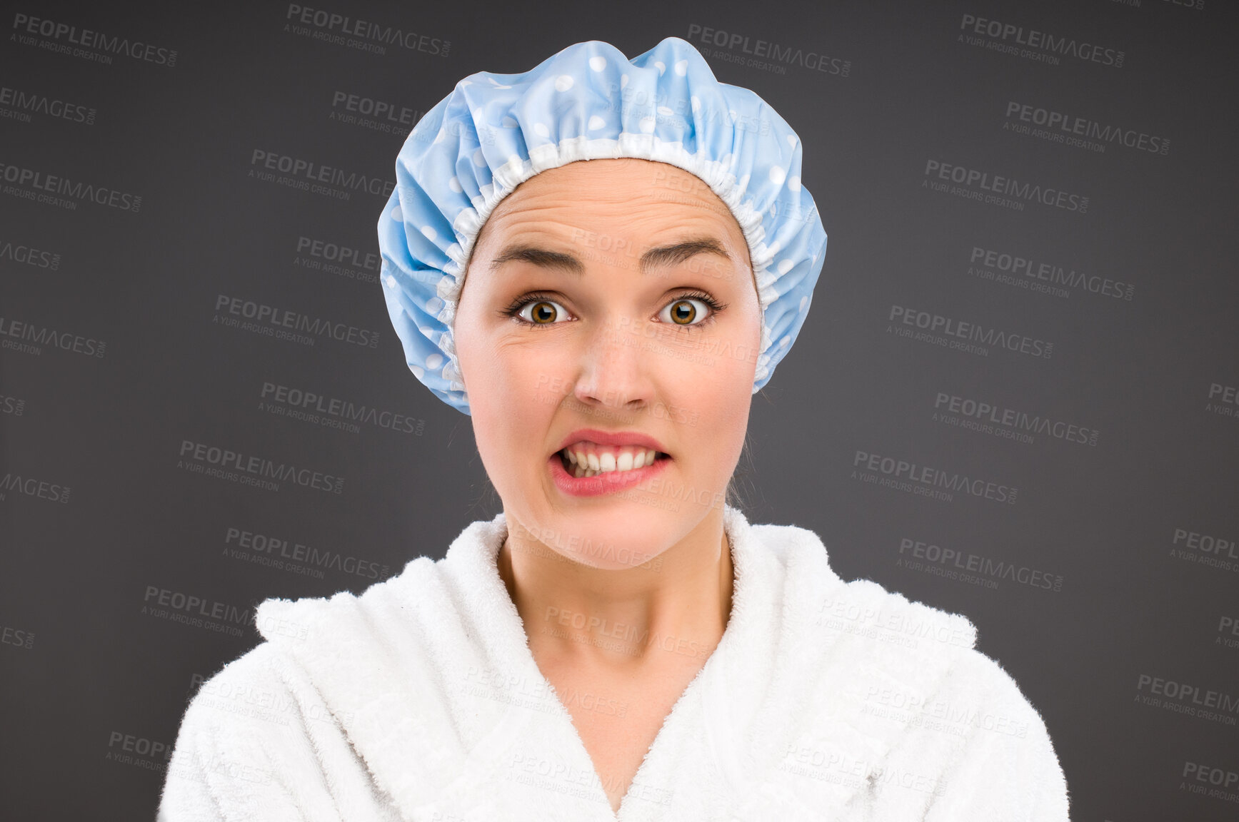 Buy stock photo Confused, portrait and woman with shower cap for bathing, cleaning and hygiene isolated on dark background. Question, funny and face of student in water proof hat for wellness by studio backdrop