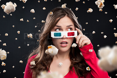 Buy stock photo Woman, 3d glasses and shock with popcorn rain for snack, eating or watching movie in black studio background. Female person, food and film with color lens eyewear in cinema for entertainment