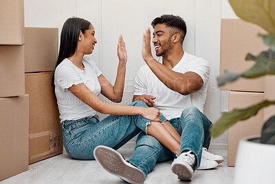 Buy stock photo Box, celebration and couple high five in new home excited for property, apartment and real estate investment, Relationship, house and man and woman celebrate with smile, boxes and happy on moving day
