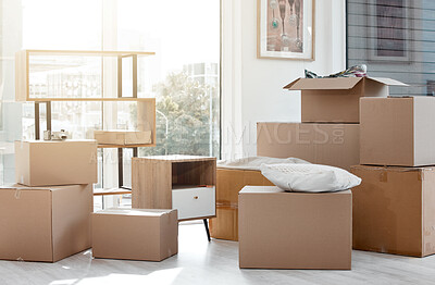 Buy stock photo Shot of boxes in a new and empty home during the day