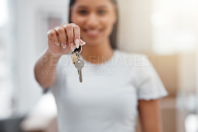 Buy stock photo Shot of an unrecognisable woman standing alone in her new home and holding her house keys
