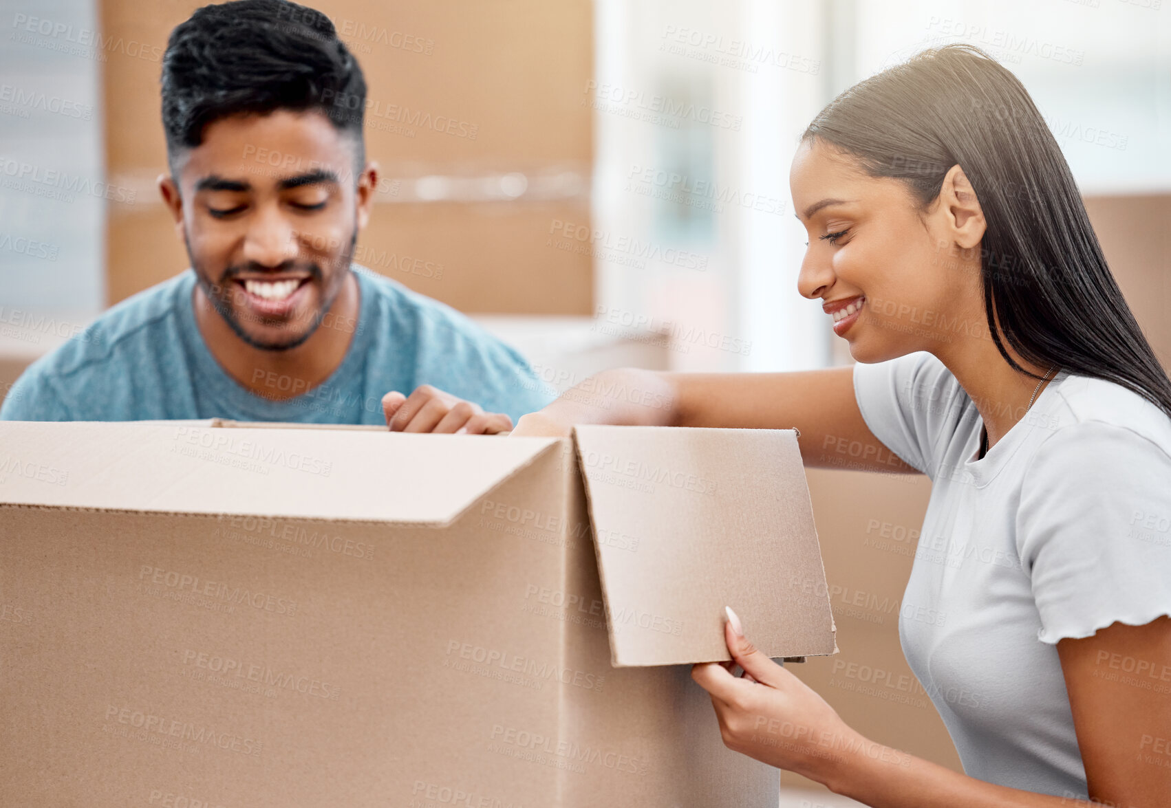 Buy stock photo Couple, moving boxes and new home property for investment opportunity with real estate, milestone or future. Man, woman and happy in apartment packing for mortgage loan, immigration or relocation