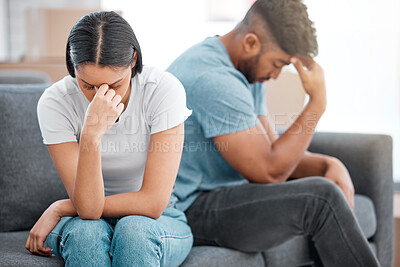 Buy stock photo Couple, marriage fight and woman feeling sad and depressed on living room sofa with relationship problem. Divorce talk, cheating anxiety and crisis of young people on a lounge couch at home thinking
