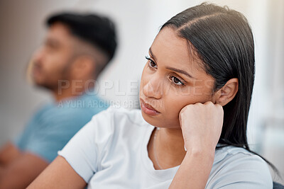 Buy stock photo Couple, fight and sad woman with stress and depressed on living room sofa with relationship problem. Divorce talk, cheating anxiety and marriage crisis of people on a lounge couch at home thinking
