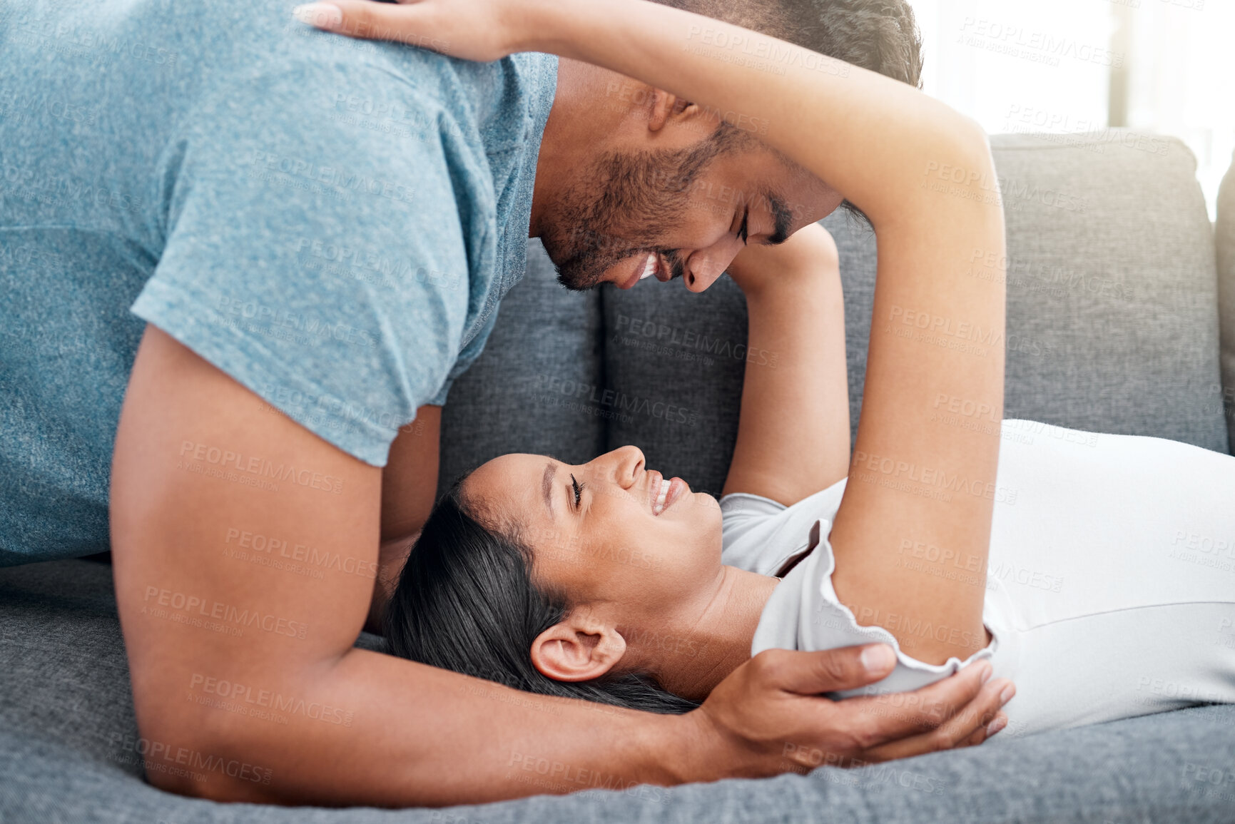 Buy stock photo Happy, couple and bonding together on sofa for calm moment in house relocation and real estate. Smile, man and woman on couch for care and support with moving home, property investment and mortgage