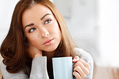 Buy stock photo Shot of a woman daydreaming while drinking coffee