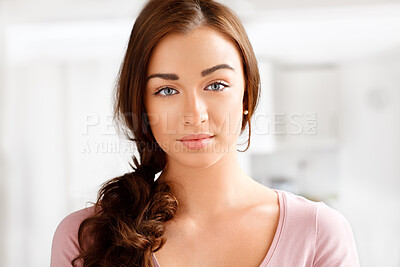 Buy stock photo Shot of a beautiful young woman relaxing at home