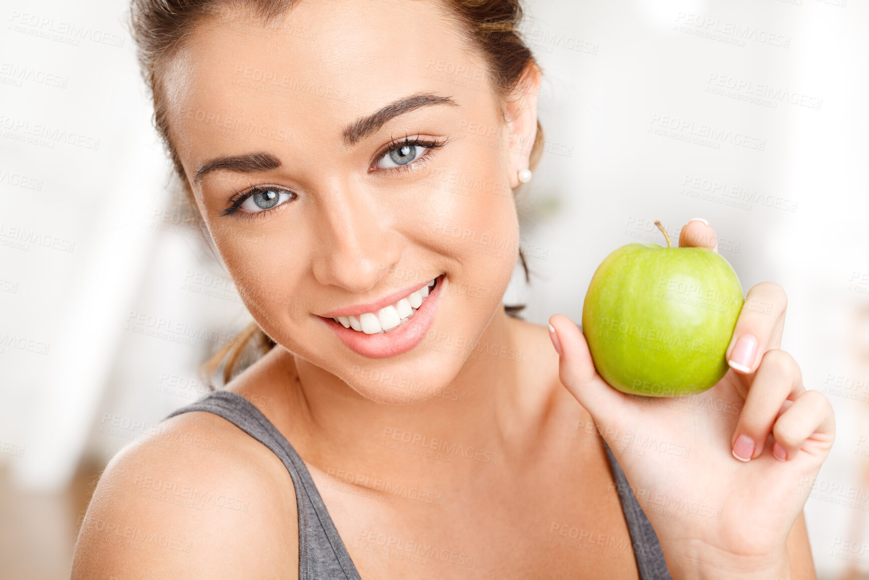 Buy stock photo Woman eating apple for healthy, fresh and balanced diet with nutrition, fruit and vitamins. Portrait face of fitness, young and happy vegan for weightloss food, organic wellness and beauty skincare