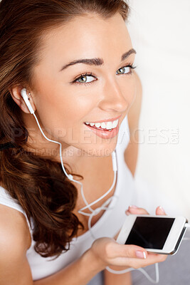 Buy stock photo Portrait, woman with earphones and music with mobile phone, audio streaming and entertainment with online playlist. Podcast, listen to radio and album with technology, connectivity and relax at home