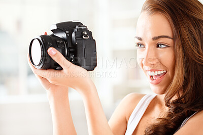 Buy stock photo Shot of a young photographer taking images