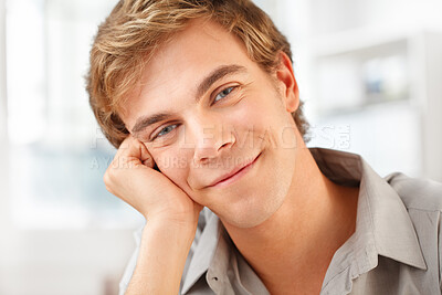 Buy stock photo Shot of a young man relaxing at home