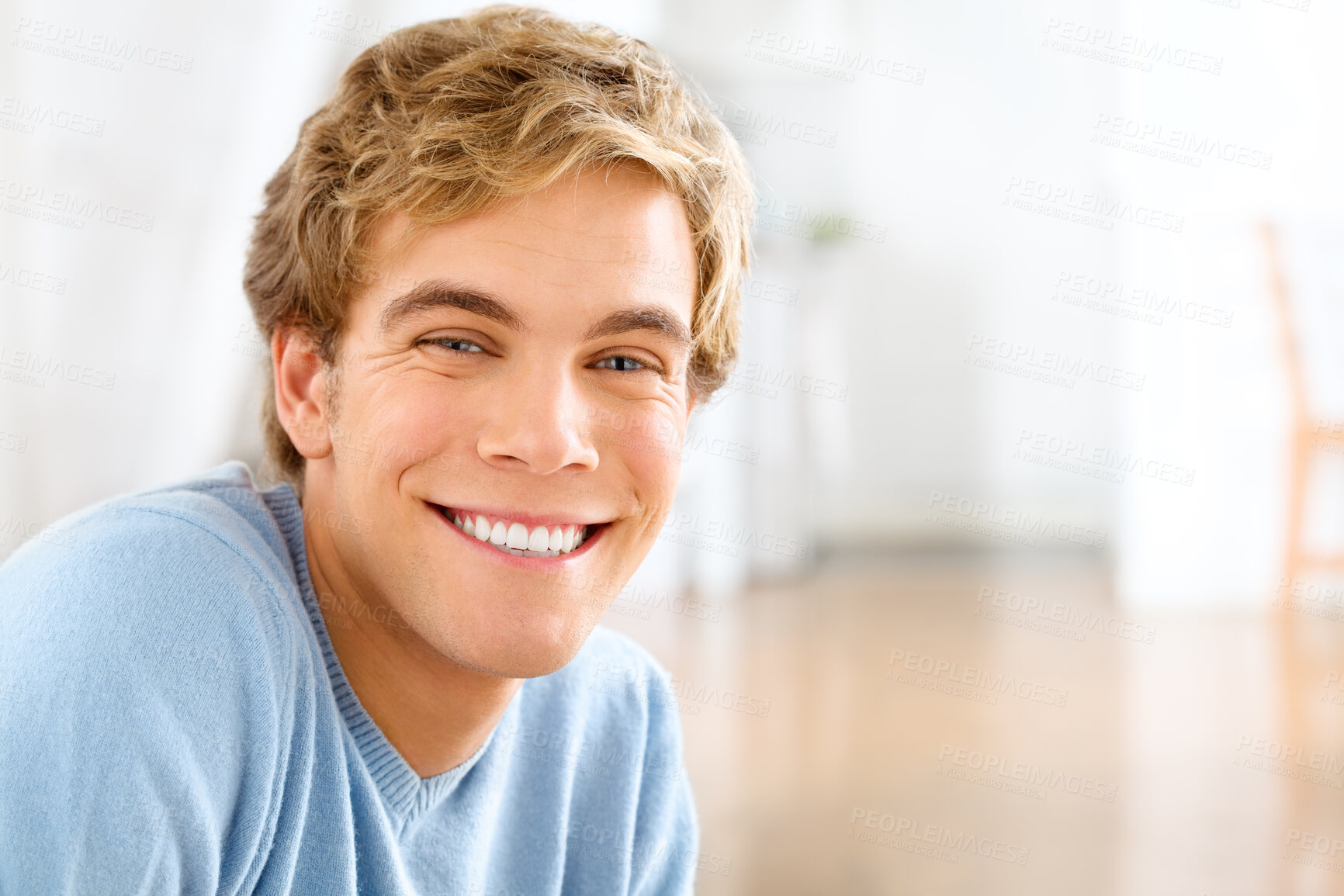 Buy stock photo Portrait, home and man with a smile, cheerful and confident guy is his living room, casual outfit and Canadian. Face, happy male person and gentleman in his lounge, happiness and joyful with wellness