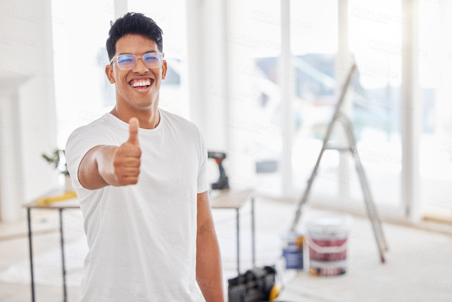 Buy stock photo Thumbs up, man and portrait in home for renovations, building and construction in apartment. Smile, handyman or contractor and success for maintenance, design and real estate project with happiness