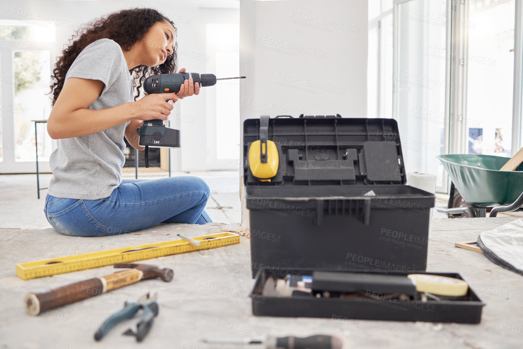 Buy stock photo Construction, drill and wall with DIY woman in home for decoration, maintenance or repairs. Design, power tools and project management with person in apartment for building, improvement or remodel