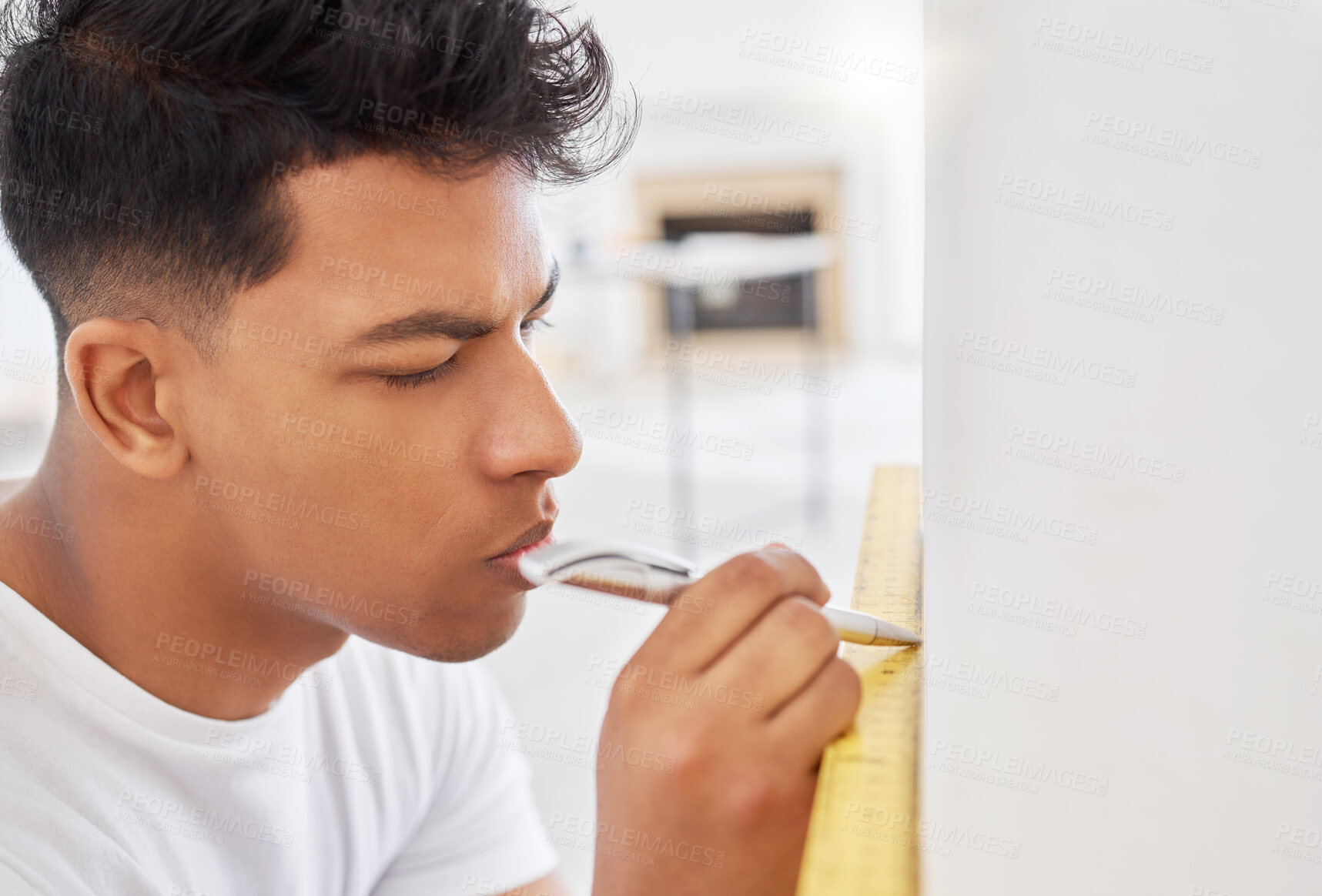 Buy stock photo Shot of a man using a spirit level while renovating a house