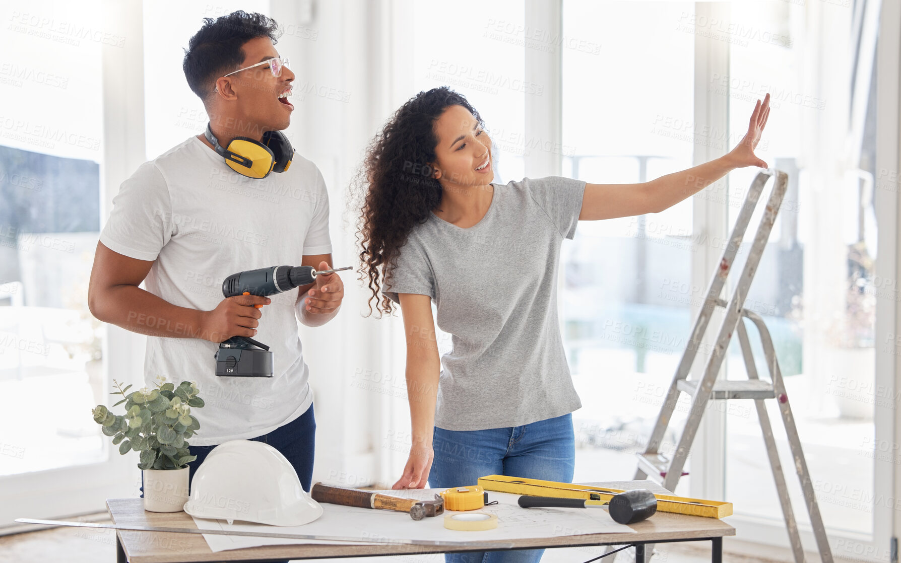 Buy stock photo Maintenance, renovation and planning with a couple in the new home together for a remodeling project. Construction, real estate or property vision with a man and woman bonding over house maintenance