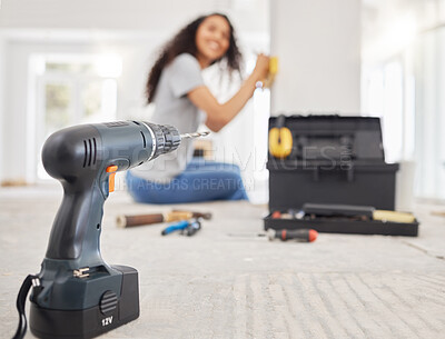 Buy stock photo Shot of a cordless drill and other tools in a room under renovations