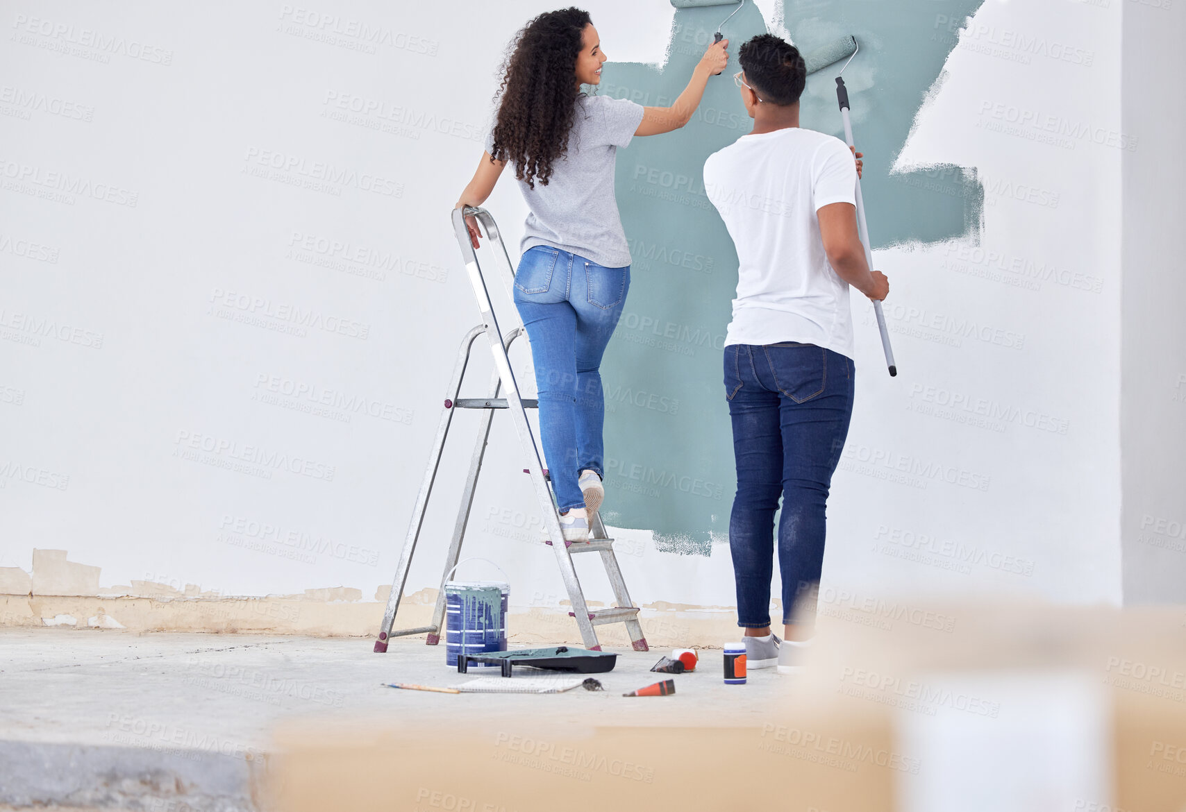 Buy stock photo Love, couple and paint wall in house, apartment and interior design or renovation project for upgrade. Man, woman and back together for diy home improvement, remodeling and maintenance for makeover.