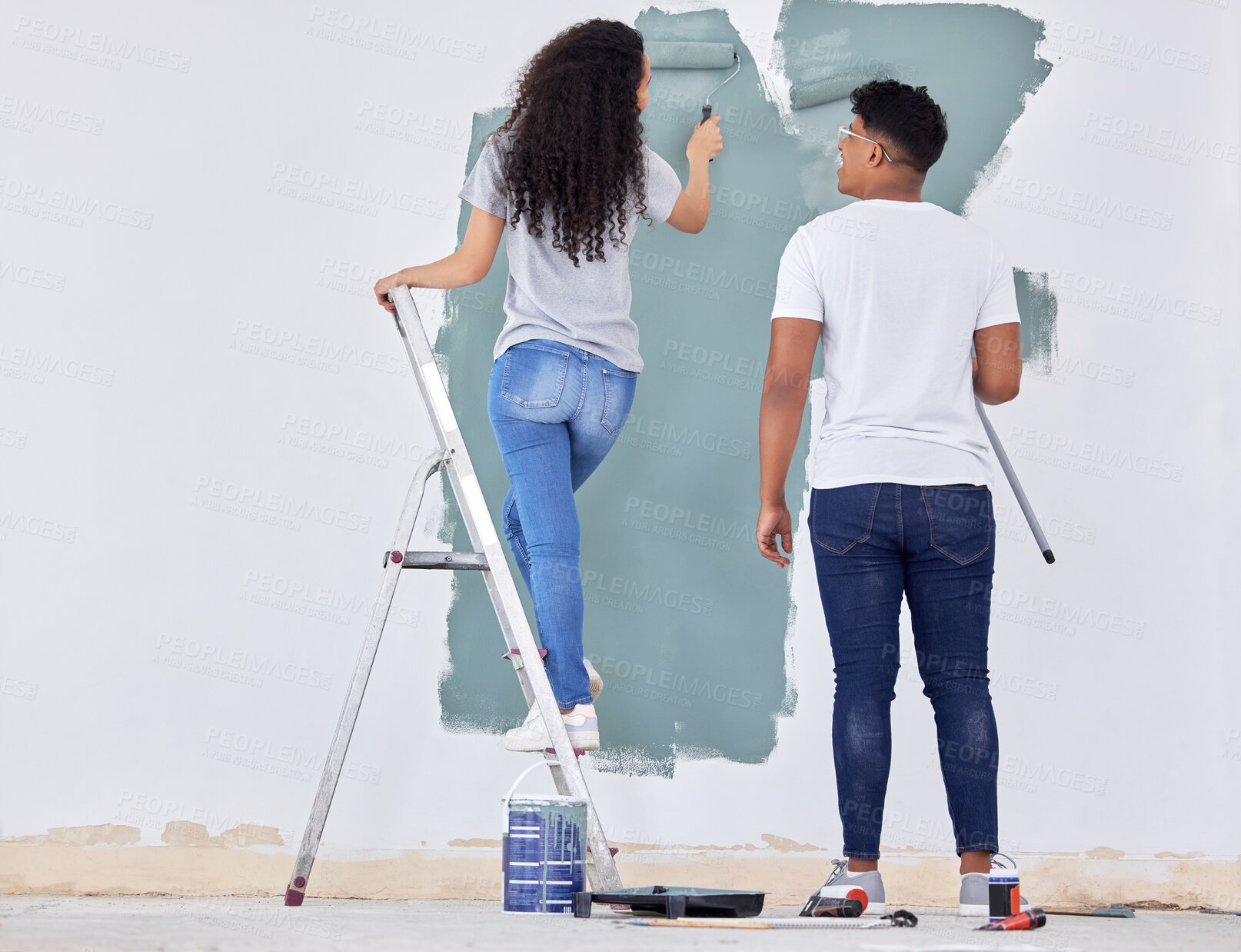 Buy stock photo Happy, couple and paint wall in house, new apartment and interior design or renovation project for upgrade. Man, woman and together for diy home improvement, remodeling and maintenance for makeover.